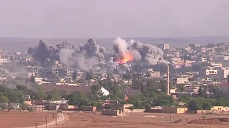 https://upload.wikimedia.org/wikipedia/commons/e/ed/Coalition_Airstrike_on_ISIL_position_in_Kobane.jpg